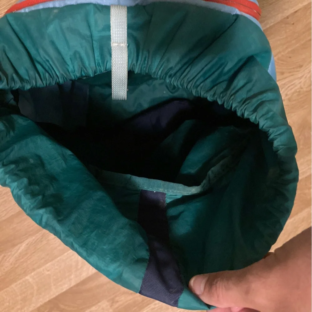 cotopaxi navy blue light blue green striped backpack